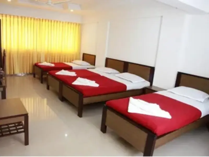 Spacious 4 Bed Non-AC Room with four comfortable beds, clean interiors, ample space, and essential amenities for a relaxing group or family stay.